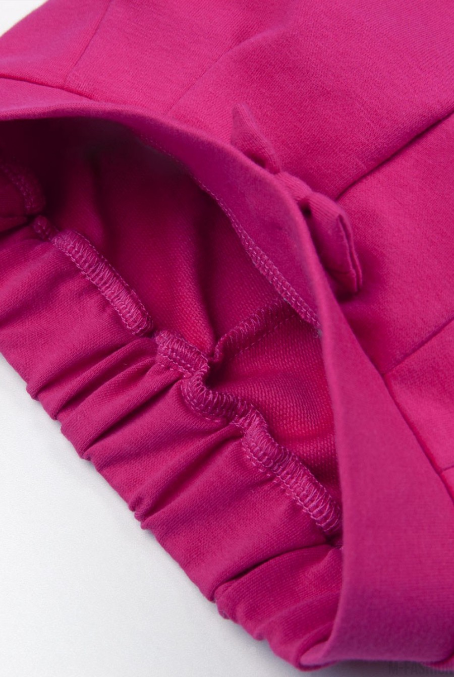 Розовые брюки из футера с бантом на резинке и подворотами- Фото 6