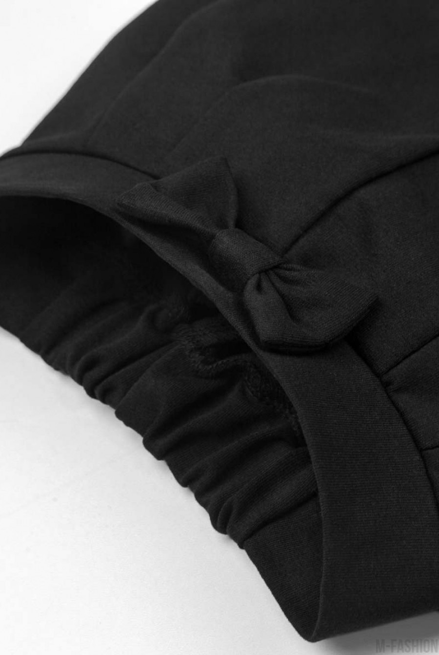 Черные брюки из футера на резинке и с подворотами- Фото 5