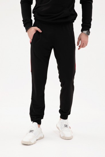 Черные трикотажные штаны с цветными вставками