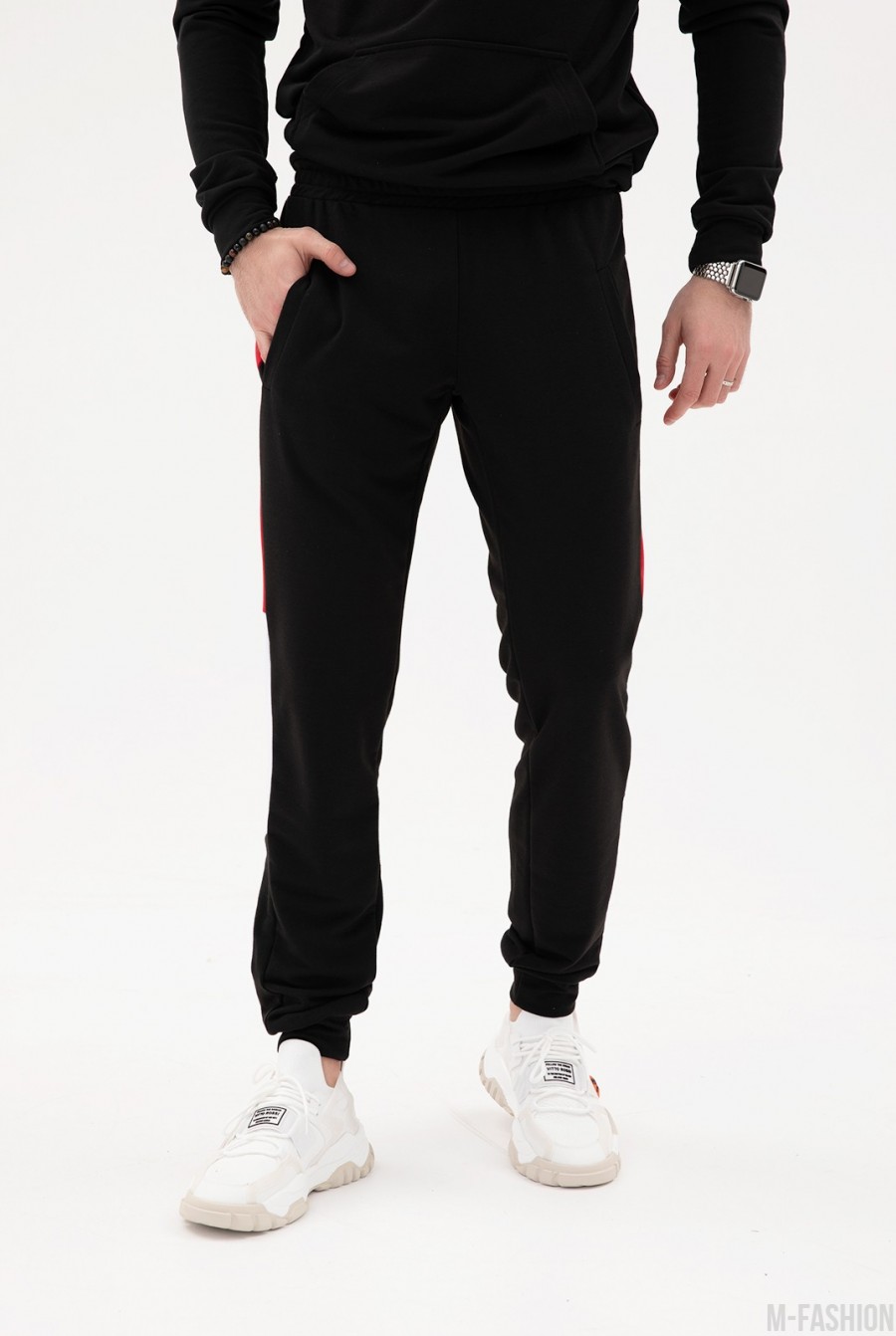 Черные трикотажные штаны с цветными вставками - Фото 1