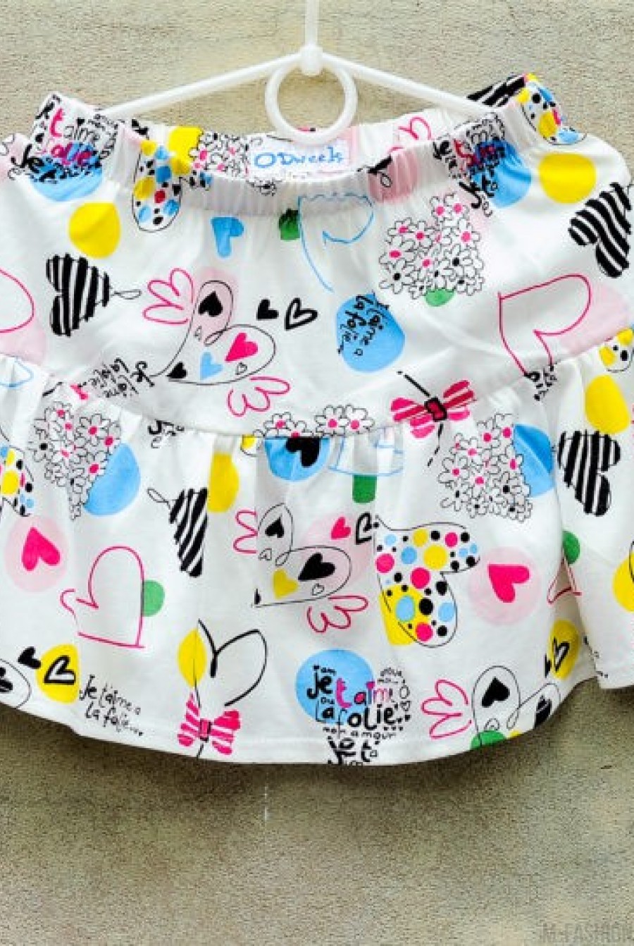 Летняя хлопковая юбка белого цвета с ярким цветным принтом - Фото 1